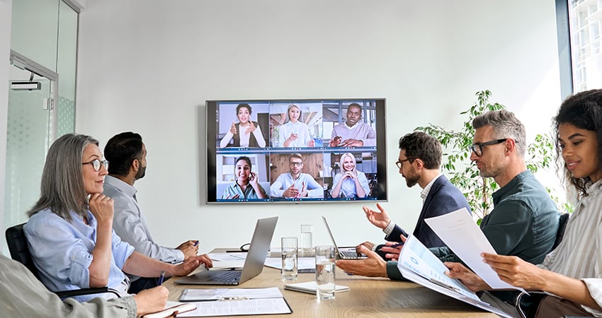 people-in-a-meeting-room-having-a-video-call